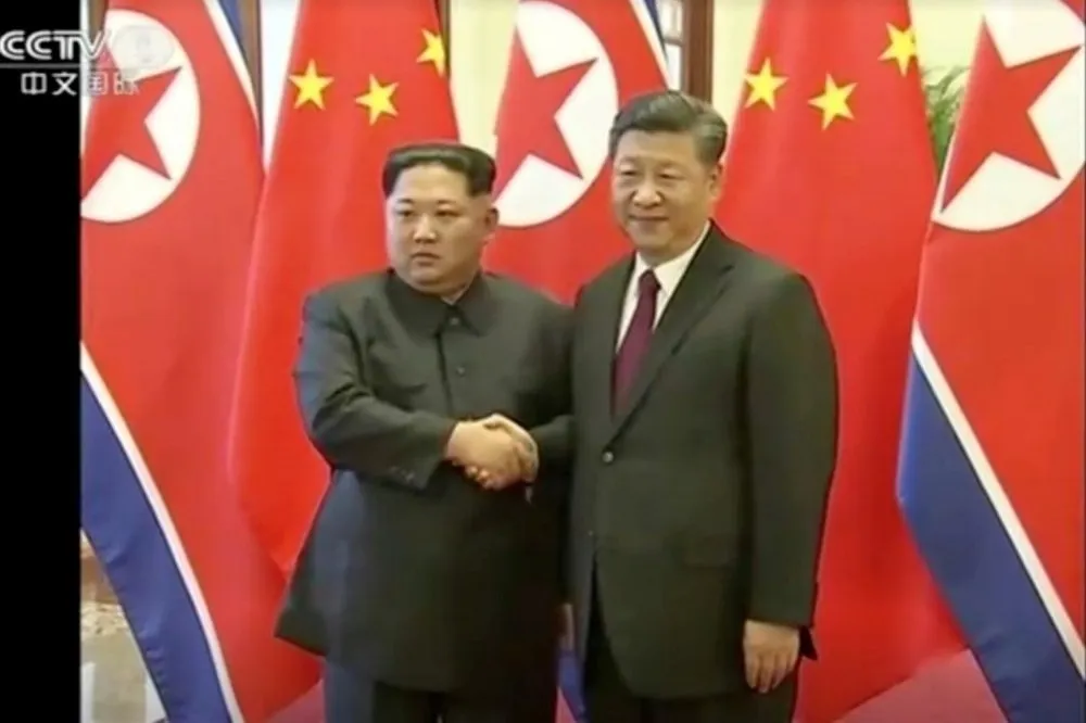 金正恩掌權後首訪中國見習近平　妻子李雪主同行