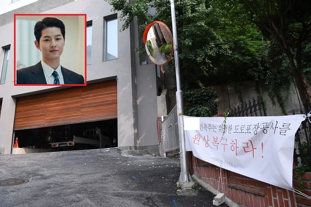 【鄰居受不了】宋仲基豪宅裝修遭白布條抗議　「路面拓寬」連政府都證實違法