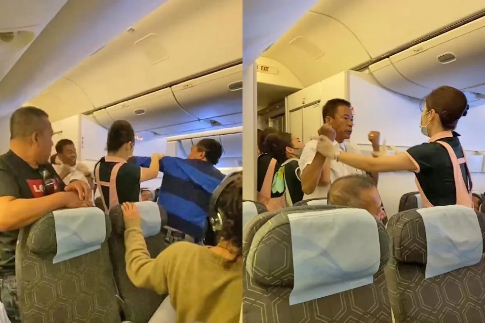 【獨家片】長榮航班爆2乘客激烈互毆　空姐奮勇阻止成「夾心餅乾」